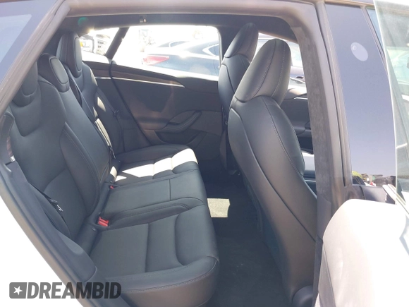2023 Tesla Model S with VIN 5YJSA1E51PF499919, listed as a IAAI auction lot 42459166 with 6,612 mi miles and . Bid and sale history available at DreamBid. Image 8.
