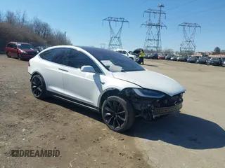 2018 Tesla Model X 75D with VIN 5YJXCAE45JF103828, listed as a IAAI auction lot 41698708 with 118,699 mi miles and . Bid and sale history available at carsss.com. Image 1.