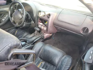 2000 Pontiac Firebird Formula z VIN 2G2FV22G4Y2175318, wystawiony jako Copart lot #68737224 z przebiegiem 229 394 mil mil oraz Szkoda całkowita • Salvage title. Historia ofert i sprzedaży dostępna na DreamBid. Obrazek 8.