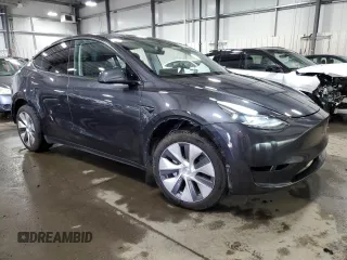 2024 Tesla Model Y Long Range with VIN 7SAYGDEE6RA253946, listed as a Copart auction lot 46699445 with 6,008 mi miles and Salvage Title. Bid and sale history available at DreamBid. Image 4.