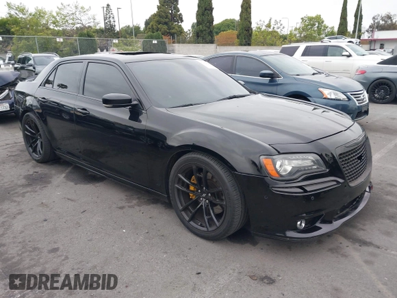 2013 Chrysler 300 SRT-8 with VIN 2C3CCAFJ9DH576184, listed as a IAAI auction lot 42162364 with 104,021 mi miles and . Bid and sale history available at carsss.com. Image 1.