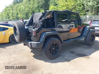 2015 Jeep Wrangler Unlimited Sport with VIN 1C4BJWDG2FL518487, listed as a IAAI auction lot 42593022 with 161,991 mi miles and . Bid and sale history available at DreamBid. Image 4.