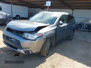 2015 Mitsubishi Outlander GT with VIN JA4JZ4AX1FZ005879, listed as a IAAI auction lot 41701299 with 212,805 mi miles and . Bid and sale history available at DreamBid. Image 2.