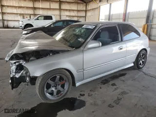 1996 Honda Civic DX with VIN 2HGEJ634XTH105568, listed as a Copart auction lot 69697714 with 130,880 mi miles and Salvage Title. Bid and sale history available at carsss.com. Image 1.