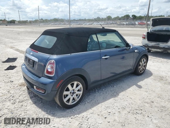 2011 MINI Convertible S with VIN WMWZP3C50BTX83220, listed as a Copart auction lot 61590205 with 80,979 mi miles and Salvage title. Bid and sale history available at DreamBid. Image 3.