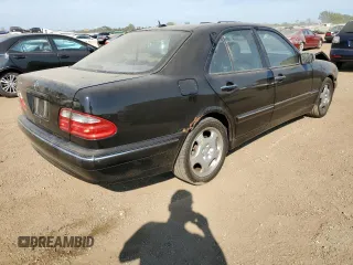 2002 Mercedes-Benz E-Class with VIN WDBJF70J22B489706, listed as a Copart auction lot 71109874 with 59,167 mi miles and Salvage Title. Bid and sale history available at carsss.com. Image 3.