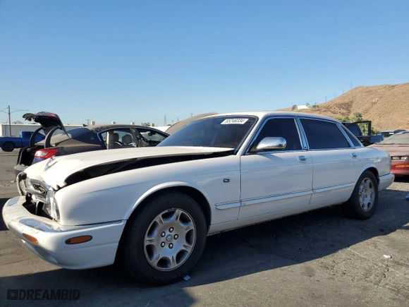 2001 Jaguar XJ VDP with VIN SAJDA24C11LF28715, listed as a Copart auction lot 65246334 with 107,965 mi miles and Salvage Title. Bid and sale history available at carsss.com. Image 1.