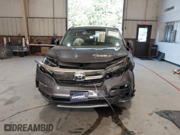 2021 Honda Pilot Touring 8-Passenger with VIN 5FNYF6H95MB048527, listed as a IAAI auction lot 42542138 with 40,584 mi miles and . Bid and sale history available at DreamBid. Image 12.
