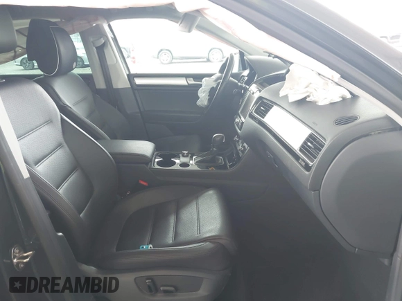 2014 Volkswagen Touareg Sport with VIN WVGEF9BP0ED015273, listed as a IAAI auction lot 42046823 with 84,694 mi miles and . Bid and sale history available at DreamBid. Image 5.
