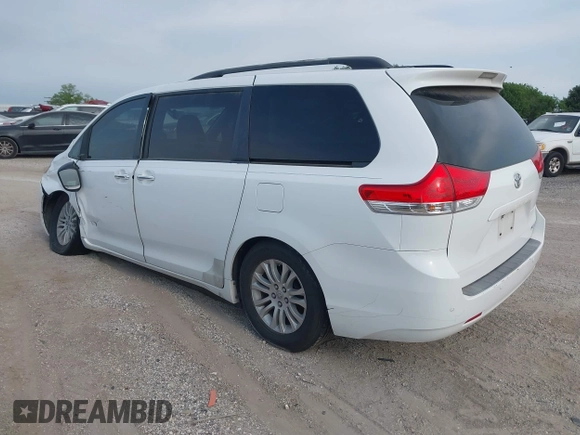 2011 Toyota Sienna XLE AAS with VIN 5TDYK3DC8BS108689, listed as a IAAI auction lot 42308965 with 179,524 mi miles and . Bid and sale history available at DreamBid. Image 3.