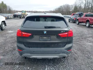 2018 BMW X1 xDrive28i with VIN WBXHT3C34J5K31430, listed as a IAAI auction lot 41954792 with 125,447 mi miles. Bid and sale history available at carsss.com. Image 16.