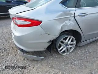 2015 Ford Fusion SE z VIN 1FA6P0H73F5113630, wystawiony jako IAAI lot #42279254 z przebiegiem 77 216 mil mil oraz . Historia ofert i sprzedaży dostępna na DreamBid. Obrazek 6.