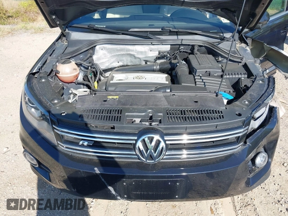 2014 Volkswagen Tiguan S z VIN WVGBV3AX5EW560393, wystawiony jako IAAI lot #42105203 z przebiegiem 102 001 mil mil oraz . Historia ofert i sprzedaży dostępna na DreamBid. Obrazek 10.