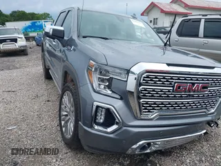 2019 GMC Sierra 1500 Denali with VIN 1GTU9FEL7KZ355632, listed as a IAAI auction lot 42487913 with 51,467 mi miles and . Bid and sale history available at DreamBid. Image 1.