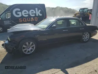 2004 Jaguar XJ with VIN SAJEA71C74SG02851, listed as a Copart auction lot 69056994 with 0 mi miles and Salvage Title. Bid and sale history available at carsss.com. Image 1.