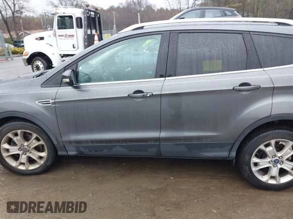2015 Ford Escape Titanium with VIN 1FMCU9JX6FUB79093, listed as a IAAI auction lot 41805057 with 87,788 mi miles. Bid and sale history available at carsss.com. Image 14.