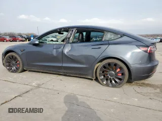 2021 Tesla Model 3 Performance with VIN 5YJ3E1EC5MF850673, listed as a Copart auction lot 47560665 with 96,950 mi miles and Salvage Title. Bid and sale history available at DreamBid. Image 2.