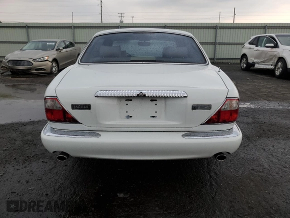1999 Jaguar XJ with VIN SAJKD6041XC876928, listed as a Copart auction lot 60038405 with 63,917 mi miles and Clean title. Bid and sale history available at DreamBid. Image 6.
