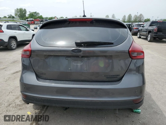 2015 Ford Focus Titanium z VIN 1FADP3N2XFL357224, wystawiony jako Copart lot #55626575 z przebiegiem 159 422 mil mil oraz Szkoda całkowita • Salvage title. Historia ofert i sprzedaży dostępna na DreamBid. Obrazek 6.
