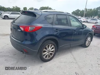 2014 Mazda CX-5 Grand Touring with VIN JM3KE2DY8E0425258, listed as a IAAI auction lot 42179452 with 132,137 mi miles. Bid and sale history available at carsss.com. Image 4.