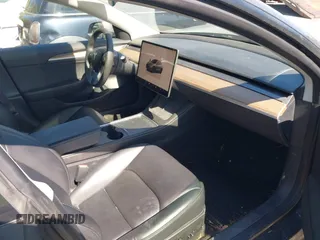 2023 Tesla Model 3 with VIN 5YJ3E1EA6PF645110, listed as a IAAI auction lot 42044357 with 24,352 mi miles and . Bid and sale history available at DreamBid. Image 5.