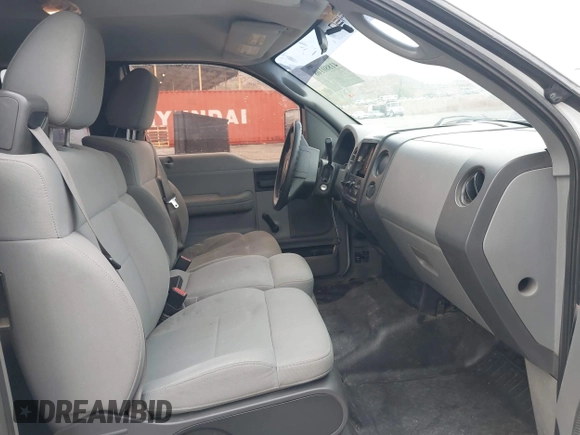 2007 Ford F-150 STX with VIN 1FTRX12W57FA45095, listed as a IAAI auction lot 41880108 with 168,216 mi miles and . Bid and sale history available at DreamBid. Image 5.