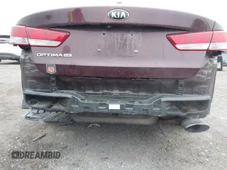 2016 Kia Optima LX with VIN 5XXGT4L31GG053429, listed as a IAAI auction lot 42464513 with 122,397 mi miles and . Bid and sale history available at DreamBid. Image 6.