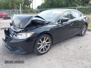 2016 Mazda Mazda6 i Touring with VIN JM1GJ1V53G1431880, listed as a IAAI auction lot 42079970 with 111,179 mi miles. Bid and sale history available at carsss.com. Image 2.