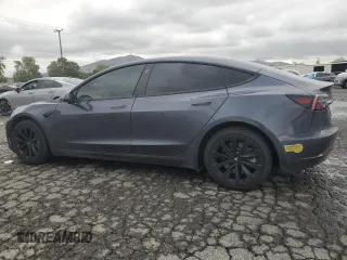 2022 Tesla Model 3 Long Range with VIN 5YJ3E1EB9NF117339, listed as a Copart auction lot 55659415 with 87,479 mi miles and Salvage Title. Bid and sale history available at DreamBid. Image 2.