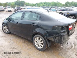2013 Kia Rio EX with VIN KNADN4A3XD6239977, listed as a IAAI auction lot 42265924 with 117,114 mi miles and . Bid and sale history available at DreamBid. Image 3.