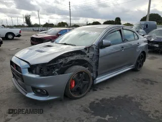 2014 Mitsubishi Lancer Evolution MR with VIN JA32W5FVXEU007527, listed as a Copart auction lot 87667745 with 74,484 mi miles and Salvage Title. Bid and sale history available at carsss.com. Image 1.