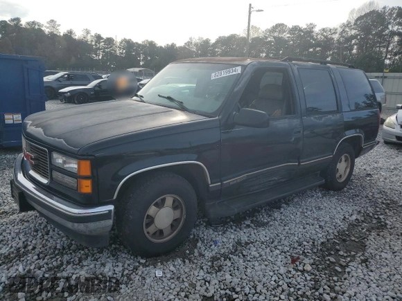 1999 GMC Yukon with VIN 1GKEC13R7XJ802387, listed as a Copart auction lot 82819934 with 438,574 mi miles and Salvage Title. Bid and sale history available at carsss.com. Image 1.