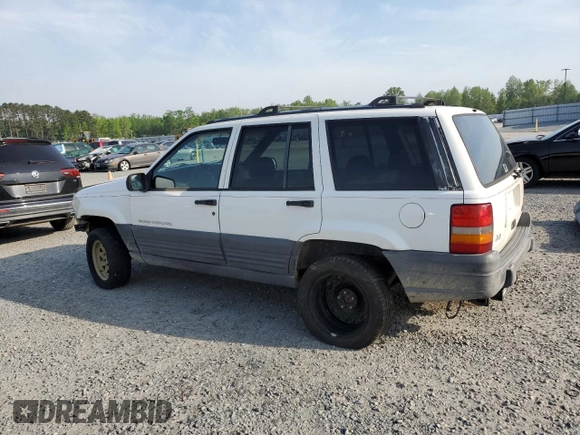 1996 Jeep Grand Cherokee Laredo z VIN 1J4EX58S3TC144191, wystawiony jako Copart lot #53153495 z przebiegiem 197 853 mil mil oraz Szkoda całkowita • Salvage title. Historia ofert i sprzedaży dostępna na DreamBid. Obrazek 2.
