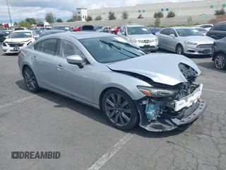 2018 Mazda 6 Grand Touring with VIN JM1GL1TY0J1306768, listed as a IAAI auction lot 41744640 with 81,798 mi miles and . Bid and sale history available at DreamBid. Image 1.