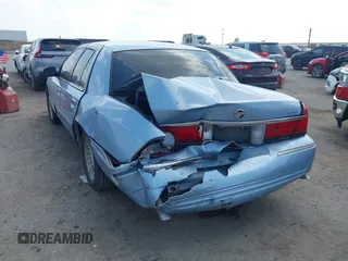 2000 Mercury Grand Marquis LS z VIN 2MEFM75W1YX673105, wystawiony jako IAAI lot #42050980 z przebiegiem 154 944 mil mil oraz . Historia ofert i sprzedaży dostępna na DreamBid. Obrazek 3.