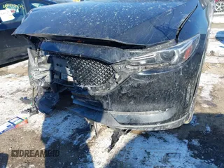 2020 Mazda CX-5 Grand Touring with VIN JM3KFBDM7L1807685, listed as a IAAI auction lot 41392313 with 91,729 mi miles and . Bid and sale history available at carsss.com. Image 6.