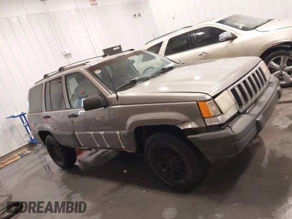 1998 Jeep Grand Cherokee Laredo with VIN 1J4GZ58S3WC343555, listed as a IAAI auction lot 41528943 with 219,146 mi miles. Bid and sale history available at carsss.com. Image 14.