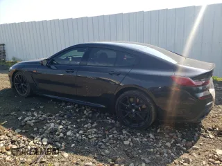 2023 BMW 8 Series M850i with VIN WBAGV8C09PCK80498, listed as a Copart auction lot 59668124 with 44,527 mi miles and Salvage Title. Bid and sale history available at carsss.com. Image 2.