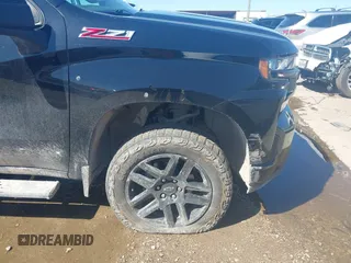 2021 Chevrolet Silverado 1500 LT Trail Boss with VIN 1GCPYFED7MZ407580, listed as a IAAI auction lot 42078081 with 64,299 mi miles and . Bid and sale history available at DreamBid. Image 6.