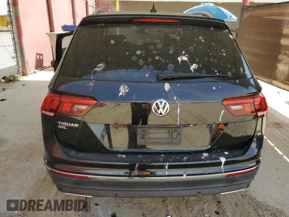 2020 Volkswagen Tiguan SE z VIN 3VV3B7AXXLM138188, wystawiony jako Copart lot #52787085 z przebiegiem 58 363 mil mil oraz Szkody całkowita. Historia ofert i sprzedaży dostępna na DreamBid. Obrazek 6.