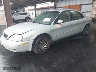 2003 Mercury Sable GS with VIN 1MEFM50U73A612479, listed as a IAAI auction lot 41907556 with 198,541 mi miles. Bid and sale history available at carsss.com. Image 2.