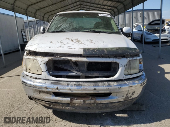 1997 Ford F-150 with VIN 1FTDX17W0VKC53263, listed as a Copart auction lot 57114475 with 220,496 mi miles and Non repairable. Bid and sale history available at DreamBid. Image 5.