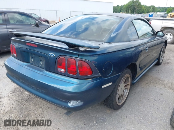 1996 Ford Mustang GT z VIN 1FALP42XXTF137304, wystawiony jako IAAI lot #42464808 z przebiegiem 166 565 mil mil oraz . Historia ofert i sprzedaży dostępna na DreamBid. Obrazek 4.