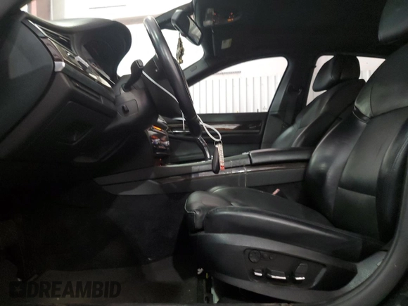 2011 BMW 7 Series with VIN WBAKX6C50BC197118, listed as a Copart auction lot 73686234 with 166,393 mi miles and Clean title. Bid and sale history available at DreamBid. Image 7.