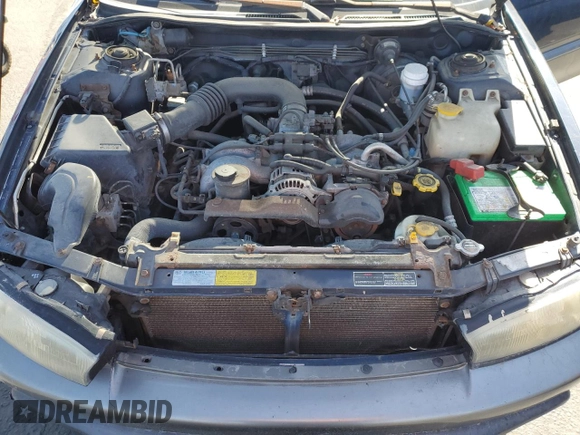 1996 Subaru Legacy with VIN 4S3BG4859T6986223, listed as a Copart auction lot 57683345 with 265,568 mi miles and Salvage title. Bid and sale history available at DreamBid. Image 12.