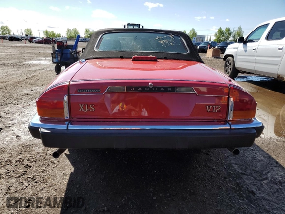 1989 Jaguar XJS z VIN SAJNL4841KC160063, wystawiony jako Copart lot #57462075 z przebiegiem 120 979 mil mil oraz Szkoda całkowita • Salvage title. Historia ofert i sprzedaży dostępna na DreamBid. Obrazek 6.