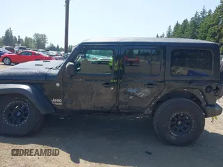 2018 Jeep Wrangler Unlimited Sport S with VIN 1C4HJXDN1JW216825, listed as a IAAI auction lot 42405799 with 37,194 mi miles and . Bid and sale history available at DreamBid. Image 14.
