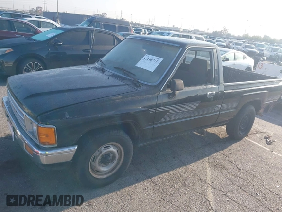 1987 Toyota Pickup with VIN JT4RN50R8H0277401, listed as a IAAI auction lot 42148719 with 239,923 mi miles and . Bid and sale history available at DreamBid. Image 2.