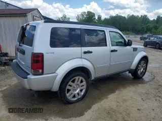 2011 Dodge Nitro Heat with VIN 1D4PU4GK0BW604975, listed as a Copart auction lot 56979275 with 160,494 mi miles and Salvage title. Bid and sale history available at DreamBid. Image 3.