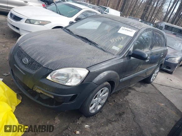 2009 Kia Rio LX with VIN KNADE243296481394, listed as a IAAI auction lot 41498863 with 59,222 mi miles. Bid and sale history available at carsss.com. Image 2.